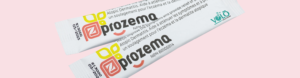 Two ProZema sticks, a probiotic formulated as the best probiotic for eczema relief, on a soft pink background